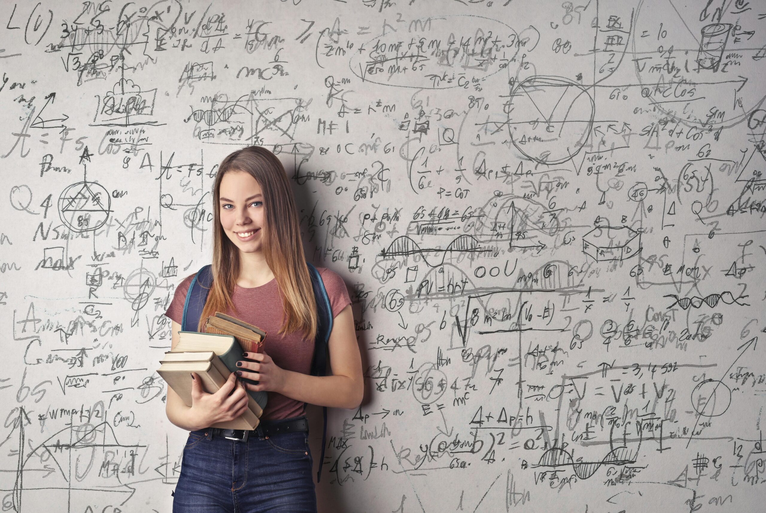 A child smiling while solving math equations on a colorful STEM watch