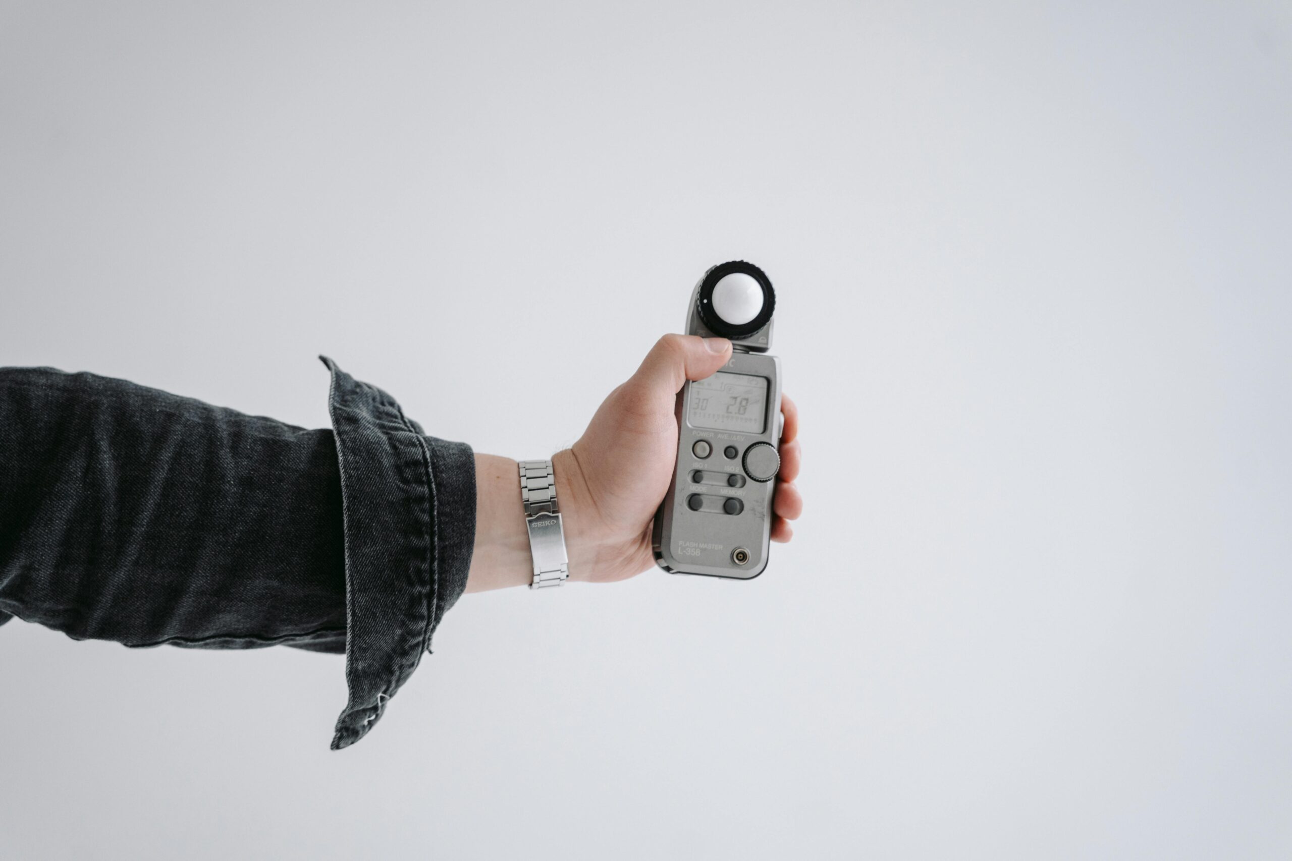 A comparison image showing a sleek modern smartwatch next to a vintage Casio calculator watch