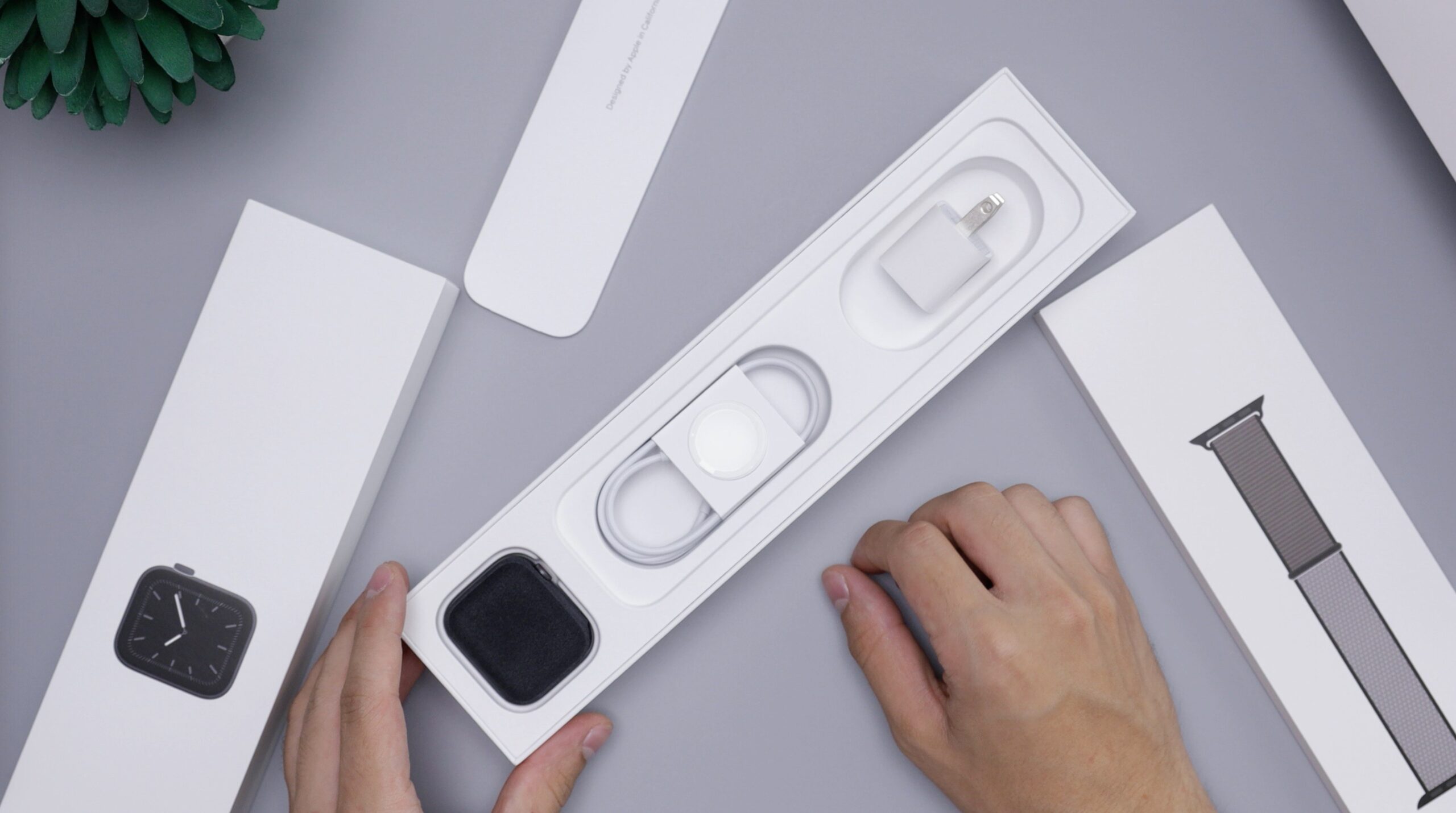 A businessperson using a watch calculator to track expenses during a meeting