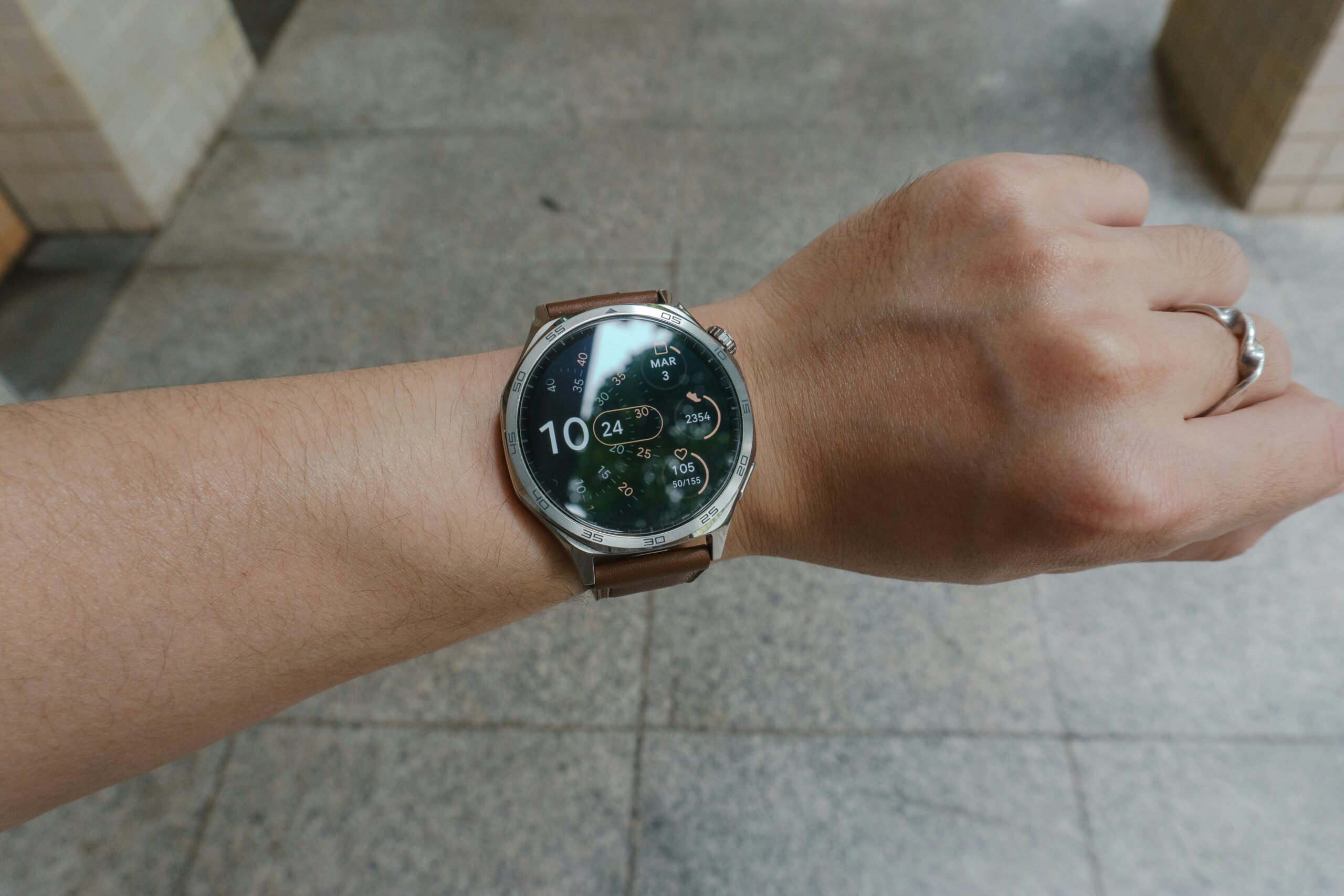 A student using a calculator watch in a classroom setting