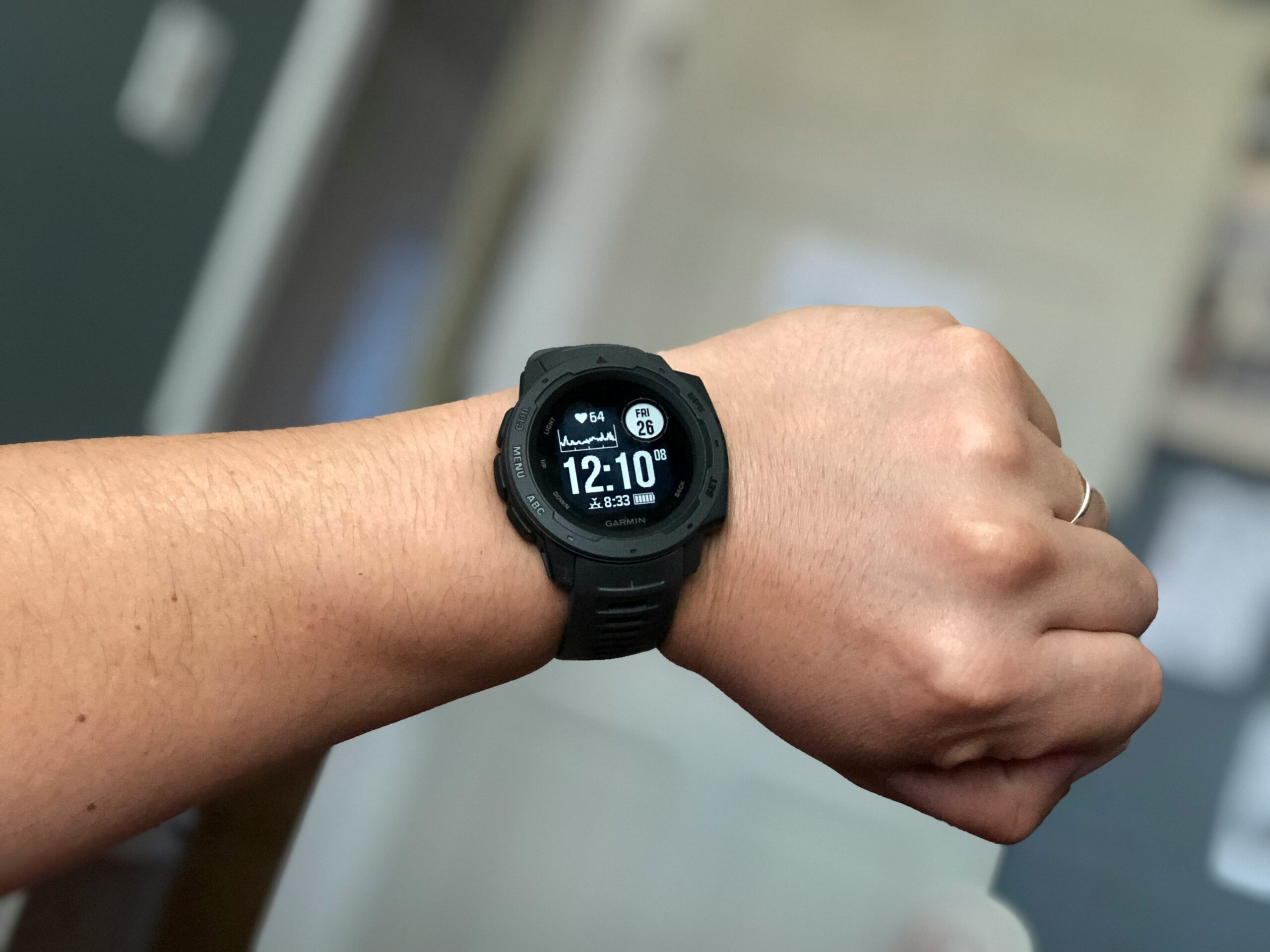 Modern student calculator watch shown side by side with textbooks