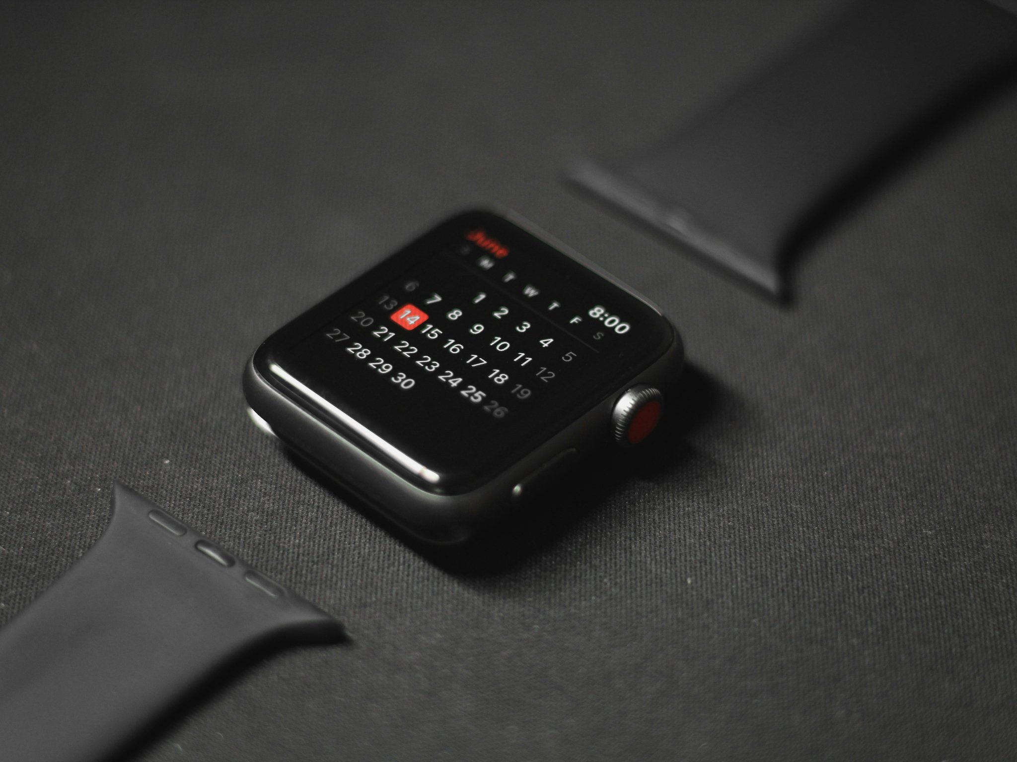 A retro Casio watch calculator alongside its modern counterpart
