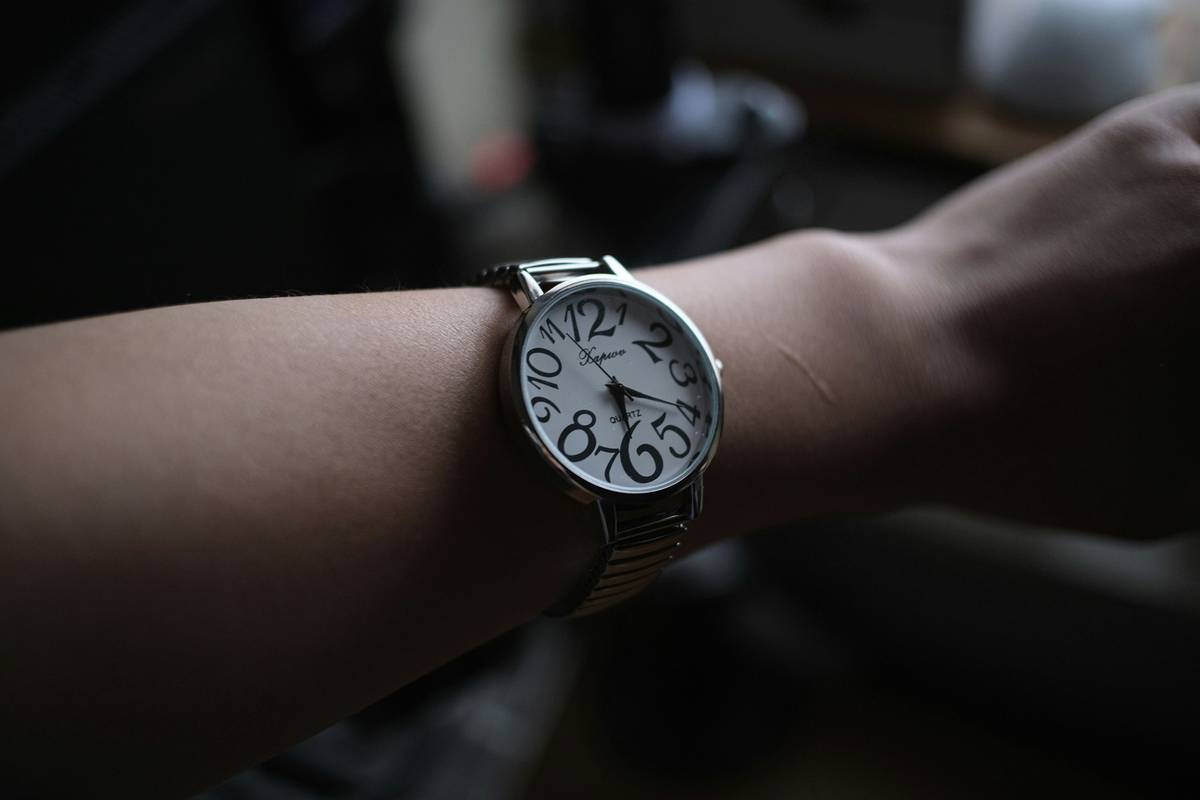 A vintage Casio watch calculator showing numbers on its small digital screen