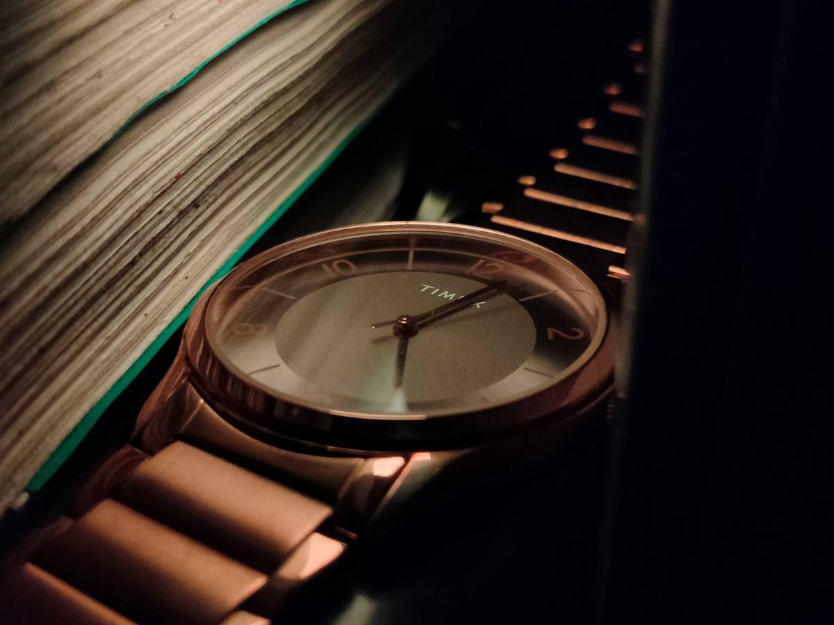 Close-up of minimalist analog watch used for watch prep study during standardized test