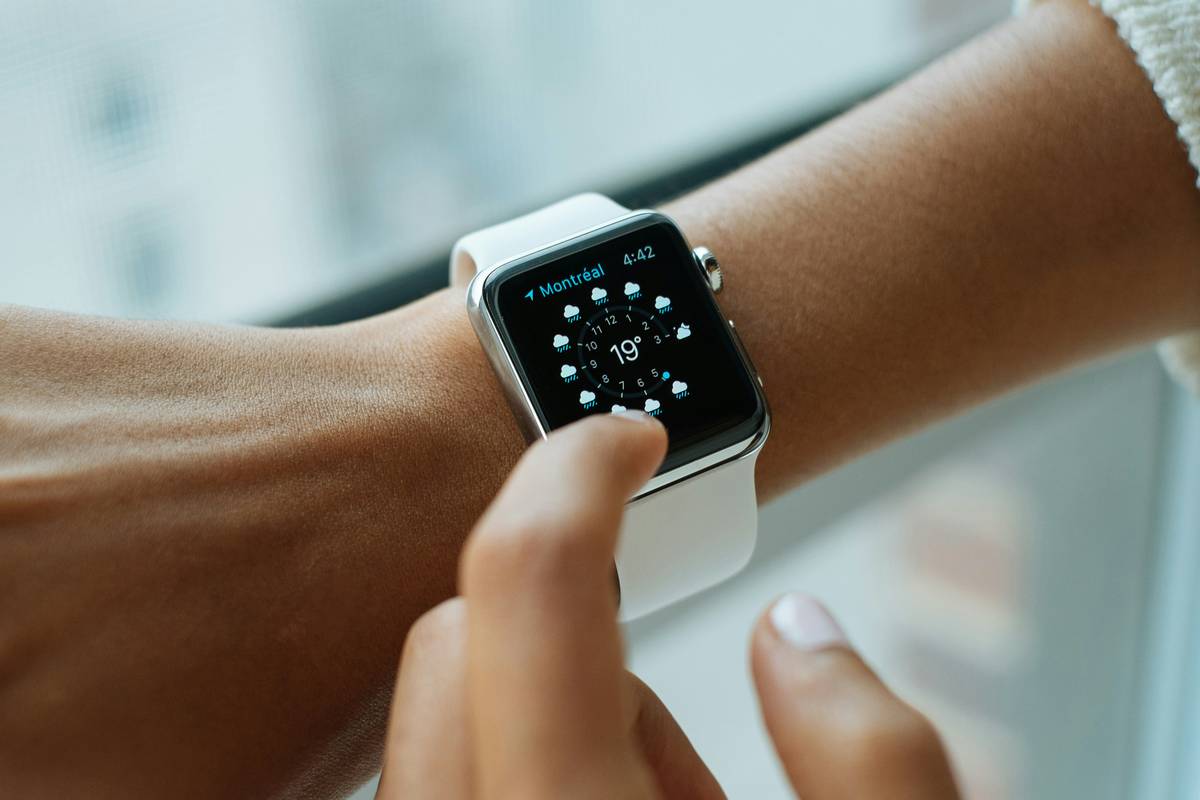 trend calc news showing professional using watch calculator during meeting