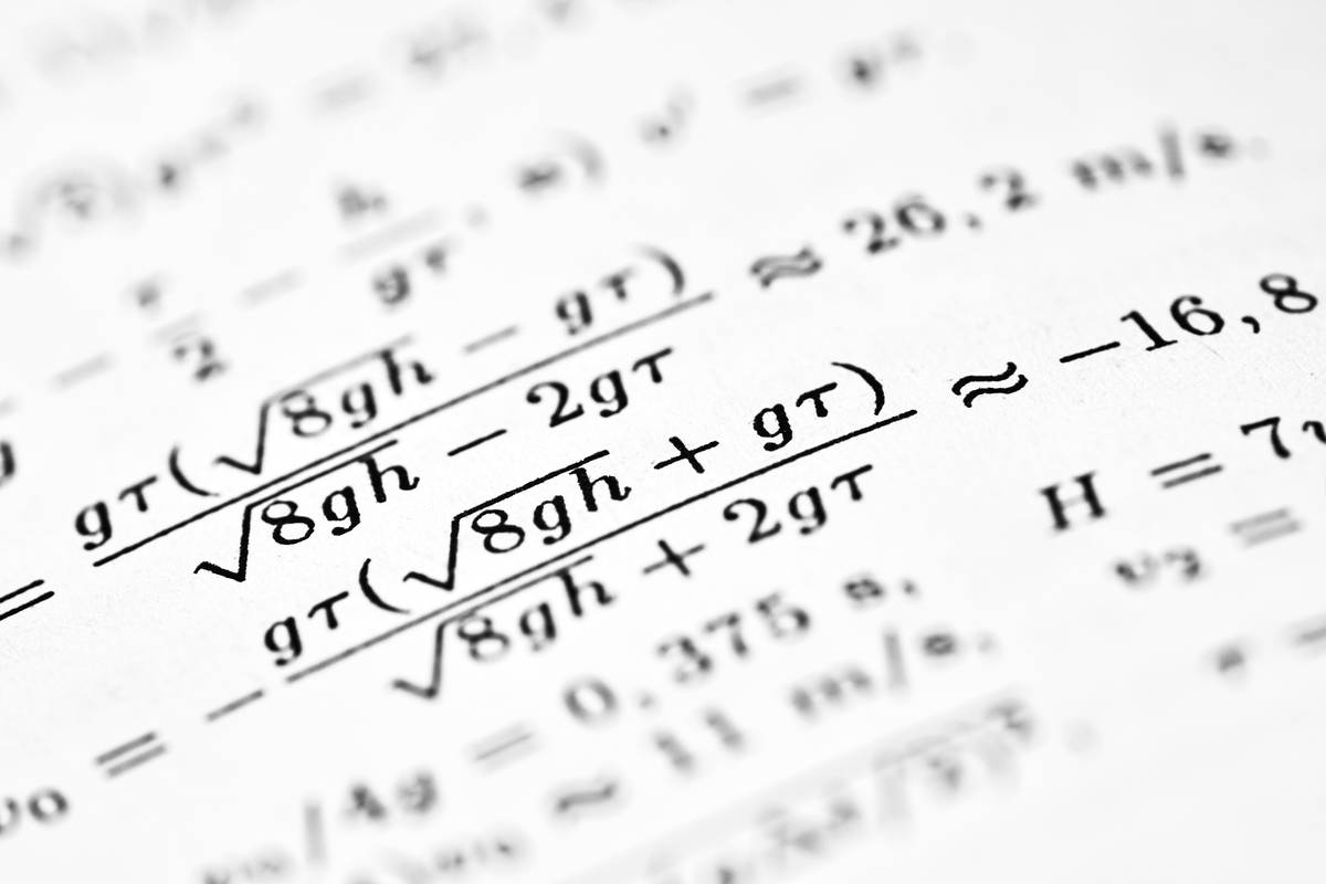 study calc watch displaying a math calculation on a digital screen during an exam setting