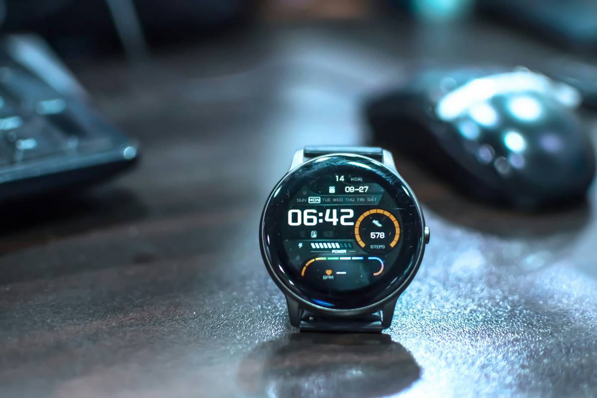 Smartwatch displaying complex calculation with update trend news overlay